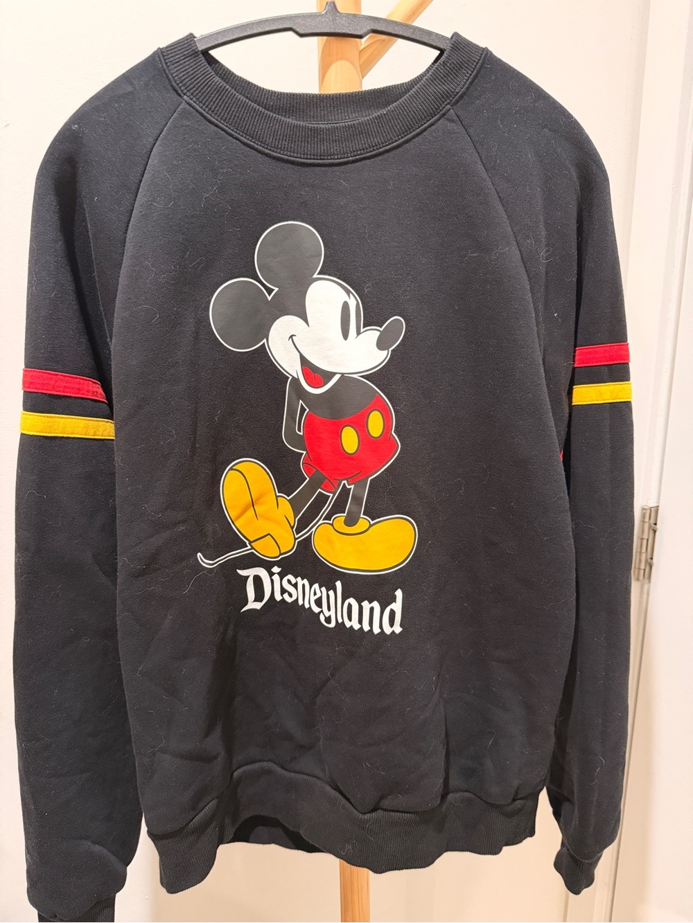 Disney Black Crewneck Sweatshirt with Mickey Graphic and Red & Yellow Accents